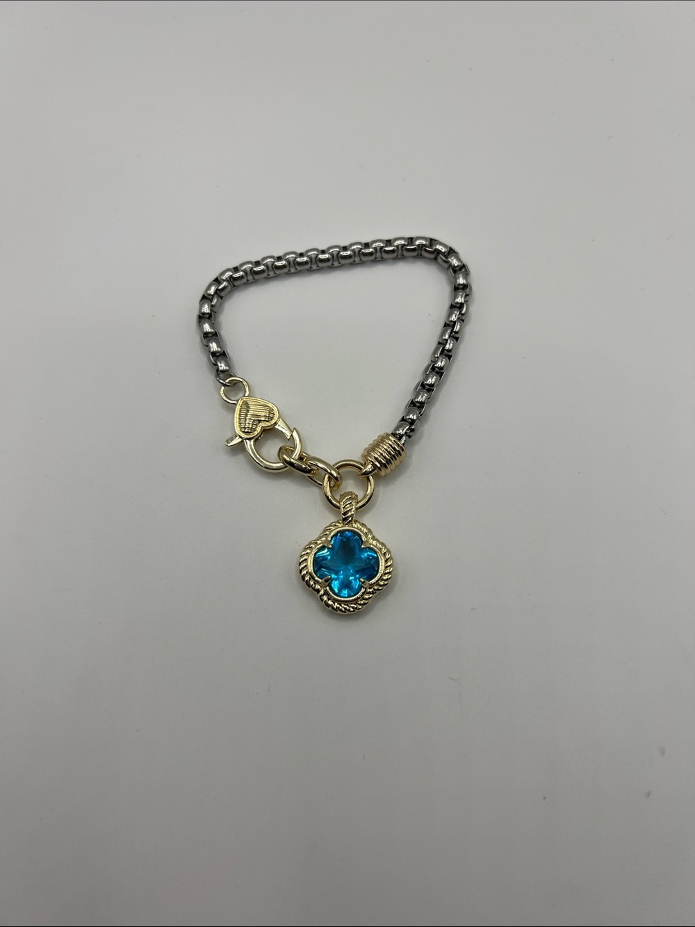 818. Two-Tone 18k Gold Plated and White Gold Plated Bracelet Blue Gem Clover
